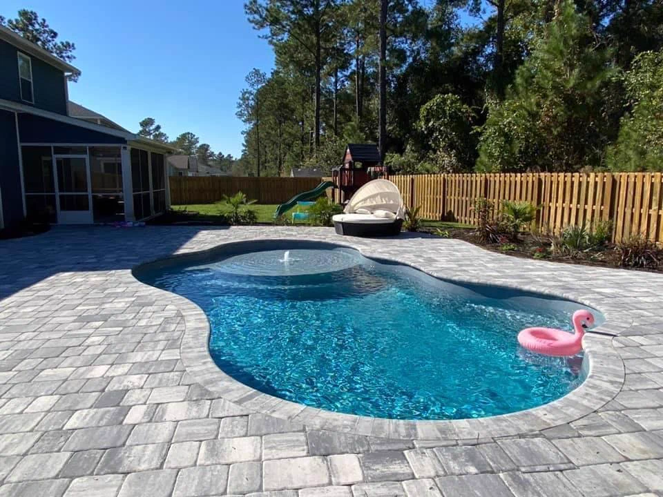 Clean fiberglass pool with clear water