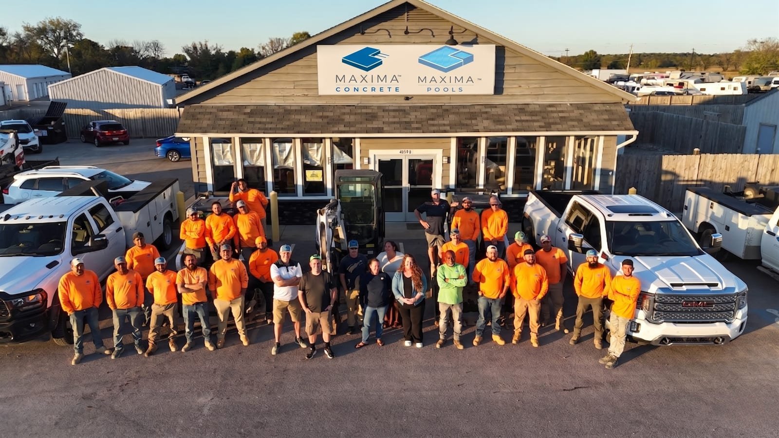 Maxima Concrete and Maxima Pools team in front of the Delaware, Ohio headquarters
